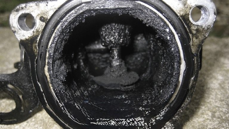Carbon blocked EGR valve removed for diagnosis